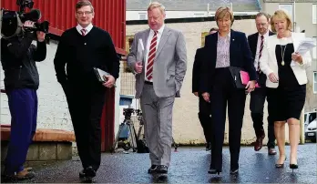  ??  ?? Happy band: Craig Levein (left) and Ann Budge (right) flank shareholde­rs yesterday