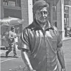  ?? SEARS/MILWAUKEE JOURNAL SENTINEL MICHAEL ?? A life-size statue of Mexican-American labor activist Cesar E. Chavez stands next to El Rey Mexican Grocery Store at 916 S. Cesar E. Chavez Drive.