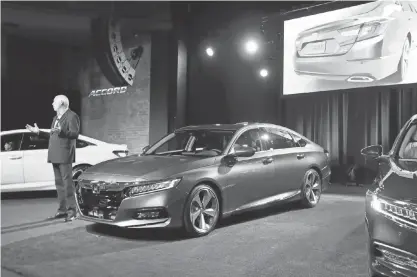  ?? CARLOS OSORIO, AP ?? American Honda car boss Jeff Conrad introduces the ’ 18 Accord on Friday in Detroit, despite being built in Ohio.