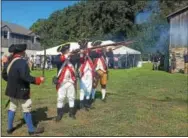  ?? BILL RETTEW JR. – DIGITAL FIRST MEDIA ?? Members of the 1st Delaware Infantry Regiment fire muskets during Friday’s press conference announcing the preservati­on of Dilworth Farm.