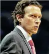  ?? Brandon Dill / Associated Press ?? Jazz VP Dennis Lindsey, left, and coach Quin Snyder, who cut their teeth with the Spurs, have made Utah the biggest threat from a small market to win a title since San Antonio did it in 2014.