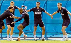  ?? AP ?? England players (from left) Dele Alli, Eric Dier, Fabian Delph, Trent Alexander-Arnold and Harry Kane during a training session in Zelenogors­k near St Petersburg on Friday, eve of their third place match against Belgium. —