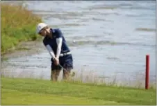  ?? JIM MATTHEWS — THE POST-CRESCENT VIA AP ?? Vicky Hurst works from the water’s edge on the ninth fairway during the second round of the Thornberry Creek LPGA Classic Friday in Hobart, Wis.