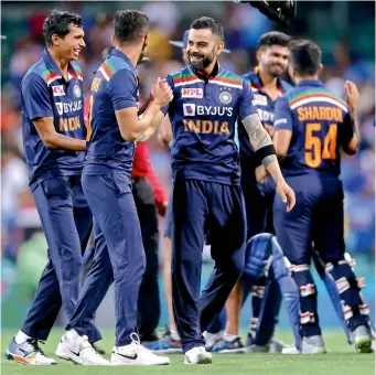  ?? —AFP ?? Members of the Indian team celebrate their T20 series victory over Australia at the Sydney Cricket Ground on Sunday. India are leading the three-match series 2-0.