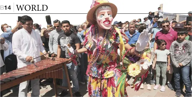  ?? OSWALDO RIVAS/AGENCE FRANCE-PRESSE ?? DANCER performs during the San Sebastian festivity in Diriamba, Nicaragua.