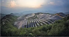  ?? CHINATOPIX, VIA ASSOCIATED PRESS ?? China may reach a carbon emissions peak in 2025, five years ahead of schedule. A photovolta­ic power station in southeast China.