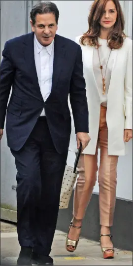  ??  ?? Defeated: Charles Saatchi with his new girlfriend Trinny Woodall