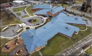  ?? TY GREENLEES / STAFF ?? Dayton’s school board approved a settlement agreement this month stemming from defects in the roof constructi­on of Wogaman School, which was built a decade ago.
