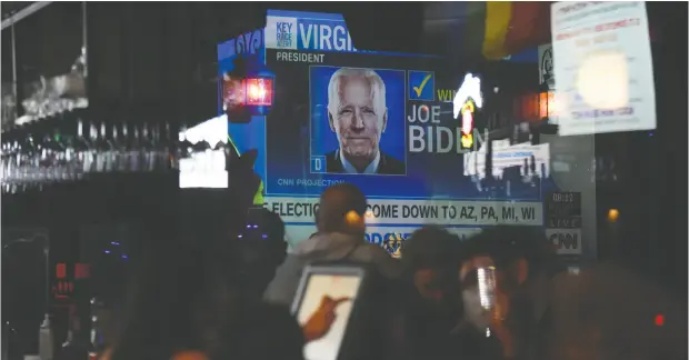  ?? CALLAGHAN O’HARE / reuters ?? Joe Biden supporters gather for a watch party on Tuesday, U.S. presidenti­al Election Day, at a bar in Houston.