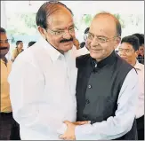  ??  ?? NDA candidate for vice president Venkaiah Naidu and finance minister Arun Jaitley greet each other in New Delhi on Friday.