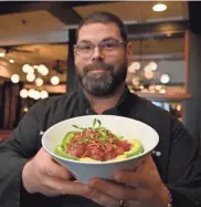  ?? ALLAN JUNG/TELEGRAM & GAZETTE ?? Mark Hawley, executive chef for Worcester Restaurant Group, with $10 Tuna Poke Bowl at The Sole Proprietor.