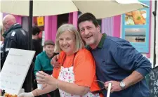  ??  ?? Diarmuid Mac a’ t-Saoir with Theresa Rafter-Moriarty on the Tig an t-Saoirsigh stall at the Dingle Food Festival where Biddy’s Irish Stew - made by Pablo the Portoguese chef - was a popular choice.