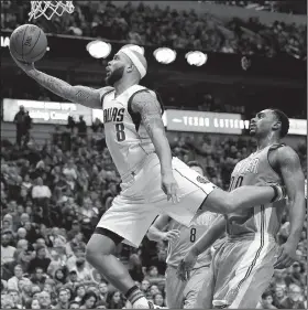  ?? AP/LM OTERO ?? Dallas Mavericks guard Deron Williams (8) drives Saturday past Denver Nuggets forward Darrell Arthur (00) during the second half in Dallas. The Mavericks won 92-81.