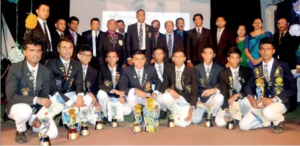  ??  ?? The three recipients of the highest accolade 'Rising Sun' and the other colours winners with the chief guest, guest of honour , principal and the members of the sports council.