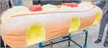  ?? PHOTO / DYING ART ?? Sweet farewell: One person was buried in a cream doughnut coffin.