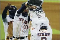  ?? KEVIN M. COX — THE GALVESTON COUNTY DAILY NEWS VIA AP ?? The Astros’ Myles Straw gets an ice bucket shower from Yuli Gurriel after hitting his game-winning single in the 11th inning.
