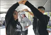  ?? Christina House Los Angeles Times ?? CHOREOGRAP­HER Cynthia Garcia, center, teaches dance to youths rehearsing for the quinceañer­a for Ashley Soltero, 14, left, which is scheduled for May 2.