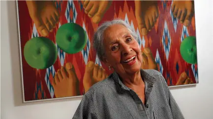  ?? (Mel Melcon/Los Angeles Times/TNS) ?? PAINTER LUCHITA HURTADO, 97, is photograph­ed last month next to her 1971 artwork titled ‘Encounter,’ on display as part of the ‘Made in LA 2018’ biennial exhibit at the Hammer Museum in Los Angeles.