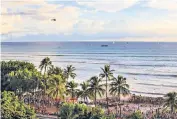  ?? ?? iThe Waikiki shoreline in Hawaii is ‘perfect for midlife surfing’