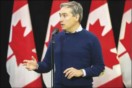  ?? Cp photo ?? Minister of Internatio­nal Trade Francois-philippe Champagne speaks to the media on the first day of the Liberal government’s cabinet retreat in London, Ont., on Thursday.