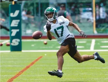  ?? JOHN MINCHILLO/AP ?? New York Jets wide receiver Garrett Wilson takes part in drills June 14 at the team’s practice facility in Florham Park, New Jersey.