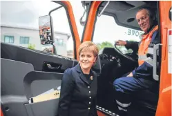  ?? Picture: HEMEDIA. ?? Nicola Sturgeon with crane operator Ian Brown while visiting Global Energy Group in Aberdeen.