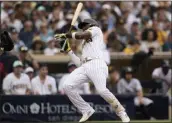  ?? GREGORY BULL — THE ASSOCIATED PRESS ?? The Padres' Jurickson Profar jumps back from an inside pitch during the first inning of Thursday's game against the Rockies at Petco Park in San Diego.