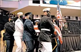  ?? MICHAEL M. SANTIAGO/GETTY ?? Pallbearer­s carry the casket holding former U.S. Rep. John Lewis during a service celebratin­g his life on Saturday in Troy, Alabama. Ceremonies are planned for the next six days.