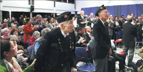  ?? YU RUIDONG / CHINA NEWS SERVICE ?? Li Wenying (left), a 95-year-old war veteran, was among those who attended the Vancouver Chinese Cultural Center on Sunday.