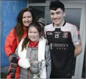  ??  ?? Liam Kerrigan is congratula­ted by his family.