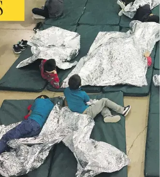  ?? U.S. CUSTOMS AND BORDER PROTECTION’S RIO GRANDE VALLEY SECTOR VIA AP ?? In this photo from U.S. Customs and Border Protection, people taken into custody related to cases of illegal entry into the United States, rest in one of the cages at a facility in McAllen, Tex., Sunday.