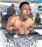  ??  ?? Taking the plunge: Danny Welbeck endures an ice bath on tour in China