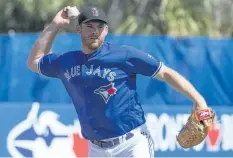  ?? FRANK GUNN/ THE CANADIAN PRESS ?? Toronto Blue Jays starting pitcher Joe Biagini throws out Philadelph­ia Phillies Cameron Rupp during spring training action in Dunedin, Fla. on Friday.