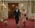  ??  ?? The Queen and corgis with Daniel Craig in the Olympics opening ceremony Bond film