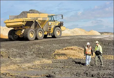  ?? AP ?? Duke Energy crews remove coal ash from old refuse ponds at a steam plant in Wilmington, N.C., in November. Critics of a proposal to subsidize coal production say such a move could prevent aging plants from closing even if they’re not economical to run.