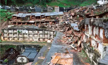  ?? ?? Partial view of the municipal cemetery of Petropolis, where several niches were damaged when they collapsed due to the heavy rains in Petropolis, Brazil on Saturday. At least nine persons died in the midst of a strong storm that hit the southeast of Brazil.