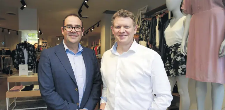  ?? Photo / Doug Sherring ?? Barkers managing director Jamie Whiting (right) will move into a group chief executive role and Max Fashions chief executive Simon West (left) will become a director.