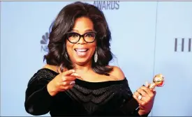  ?? Picture: REUTERS ?? HISTORIC: Oprah Winfrey poses backstage with her Cecil B DeMille Award.