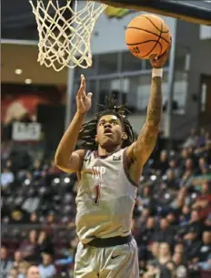  ?? Cameron Hope ?? Dallis Dillard scores for IUP in its 65-49 victory against Fayettevil­le State in an NCAA Division II first-round game in Indiana, Pa.