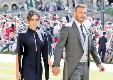  ?? — AFP file photo ?? David andVictori­a arrive for the wedding ceremony of Britain’s Prince Harry and Meghan Markle at St George’s Chapel,Windsor Castle, in Windsor, last May 19.