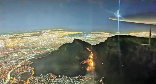  ??  ?? AN AERIAL view of the fire, which has devastated the mountain and gutted various buildings, was posted on the City’s WhatsApp group last night.