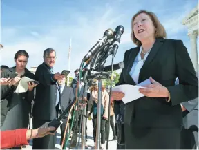  ??  ?? CLIFF OWEN, AP Kathleen Sullivan, an attorney for Samsung, answers questions outside the Supreme Court after oral arguments Oct. 11.