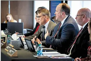  ?? Arkansas Democrat-Gazette/MITCHELL PE MASILUN ?? Arkansas State University System President Charles Welch (third from right) said at Friday’s board of trustees meeting that the system was “proud” of the Jonesboro campus’ journalism program.
