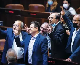  ?? (Yonatan Sindel/Flash90) ?? AFTER THE right-wing parties of the opposition voted against it, members of the Joint List celebrate the defeat of the citizenshi­p law in the Knesset this week.