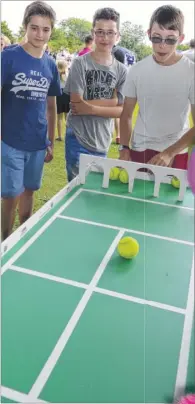  ?? Picture: Paul Amos FM4399298/ FM4399294 ?? Aaron Simmons gets a soaking from Harry Pearce; Sean McQuillan is watched by his mates Sam Loader and Eddie Meadway on the Aldington Tennis Club game