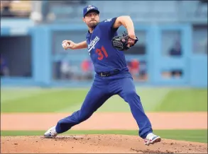  ?? Kevork Djansezian / TNS ?? Los Angeles Dodgers pitcher Max Scherzer throws against the New York Mets during the first inning at Dodger Stadium on Aug. 21 in Los Angeles. The Mets and the three-time Cy Young Award winner finalized a $130 million, 3-year deal Wednesday, a contract that shattered baseball’s record for highest average salary and forms a historical­ly impressive 1-2 atop New York’s rotation with Jacob deGrom.