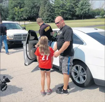  ?? MIKE NOLAN/DAILY SOUTHTOWN ?? A 10-year-old girl, the daughter of a law enforcemen­t officer, played the role of a child abduction victim Thursday in Frankfort as part of a weeklong training exercise for area police department­s.