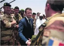  ?? Christophe Petit Tesson / EPA ?? Emmanuel Macron met members of French counter-terrorism forces in Gao, Mali, during his African trip.