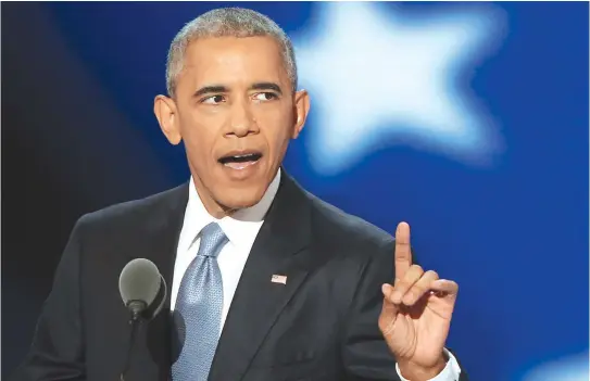  ?? STAFF PHOTOS BY NANCY LANE ?? HE’S WITH HER: President Obama delivers the keynote address on the third night of the Democratic National Convention at the Wells Fargo Center in Philadelph­ia. After the speech, Democratic presidenti­al candidate Hillary Clinton joined him on stage,...