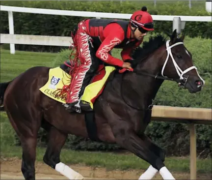  ?? GARRY JONES — THE ASSOCIATED PRESS ?? Exercise rider Martin Rivera gallops Kentucky Derby hopeful Classic Empire at Churchill Downs in Louisville, Ky., Wednesday.